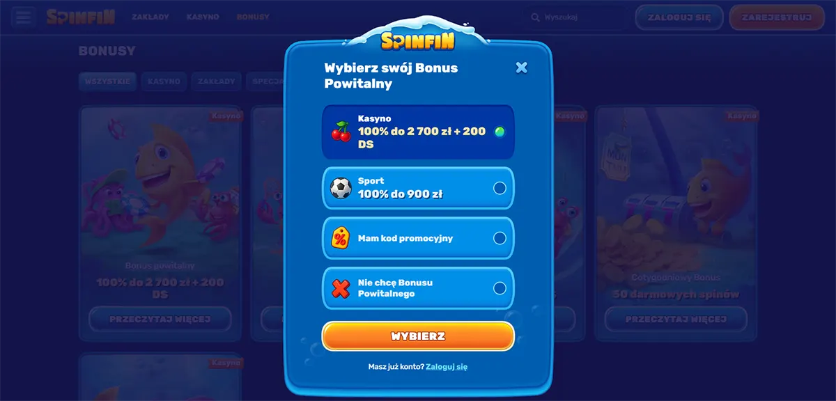 Welcome bonus selection modal (Polish localisation) for Spinfin Casino, allowing users to choose between a casino bonus (100% do 2 700 zł + 200 darmowych spinów), a sports bonus (100% do 900 zł), entering a promo code, or declining the bonus, with a prominent “Wybierz” button and login option below
